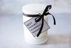 white candle with black ribbon with free printable tag