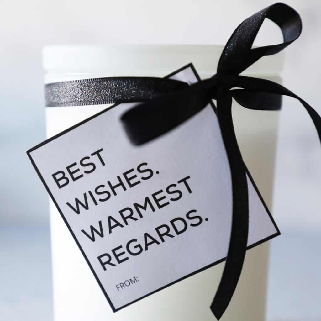 Close up of a black and white "best wishes warmest regards" gift tag