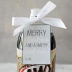 two liter of root beer with a white bow on top and a free printable gift tag