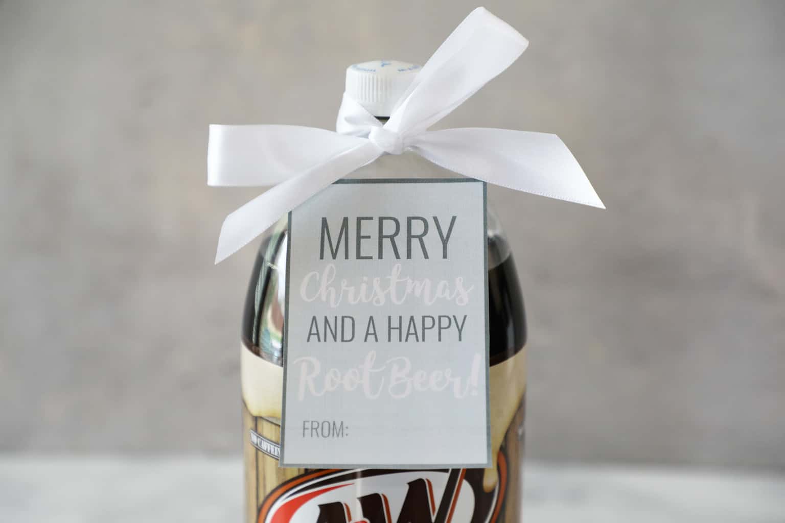 rootbeer with a gift tag and a bow