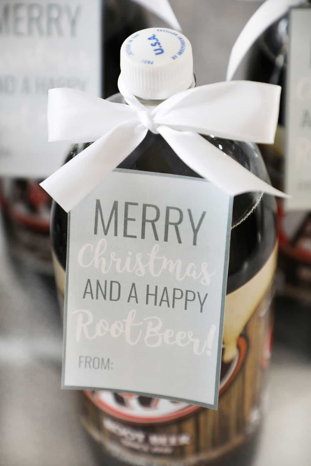 green gift tag on a two liter of rootbeer