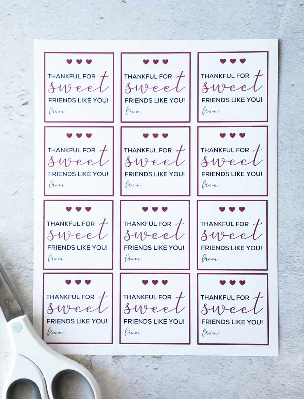 image of free printable gift tags lying on a concrete table
