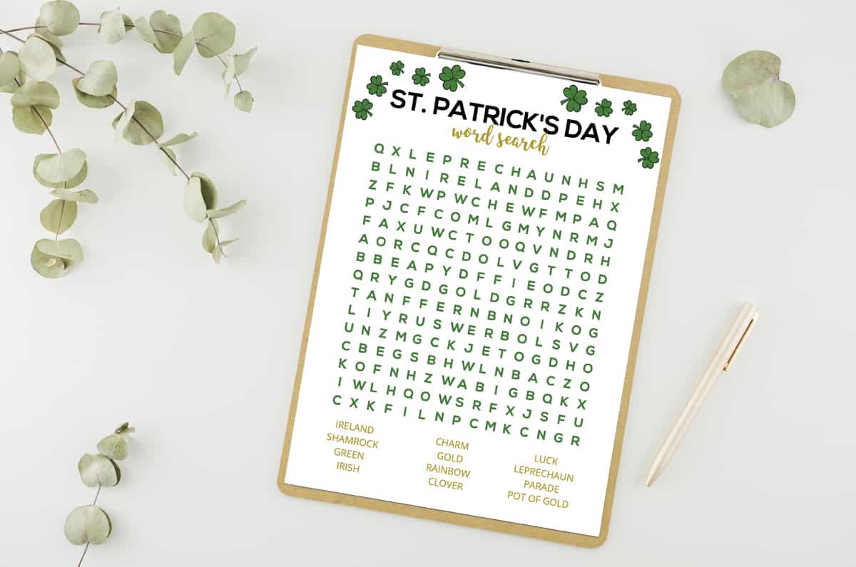 St. Patrick's Day Word search on a clipboard next to a pen and a plant