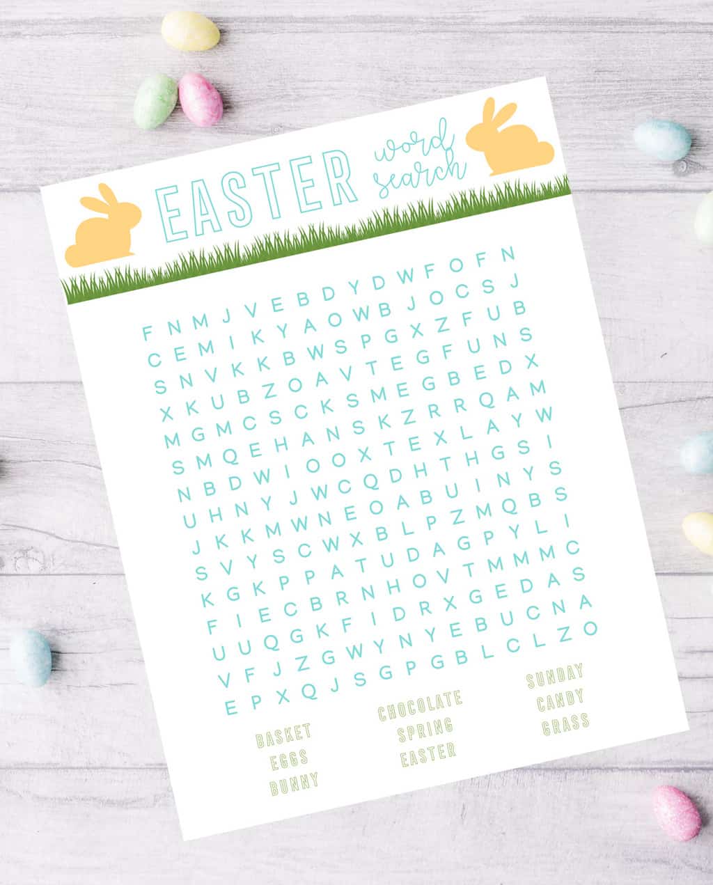 easter word search on wooden backdrop with colorful Cadbury eggs around it