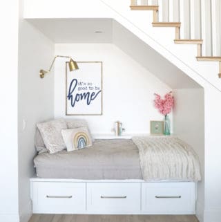 cute under the stairs reading nook