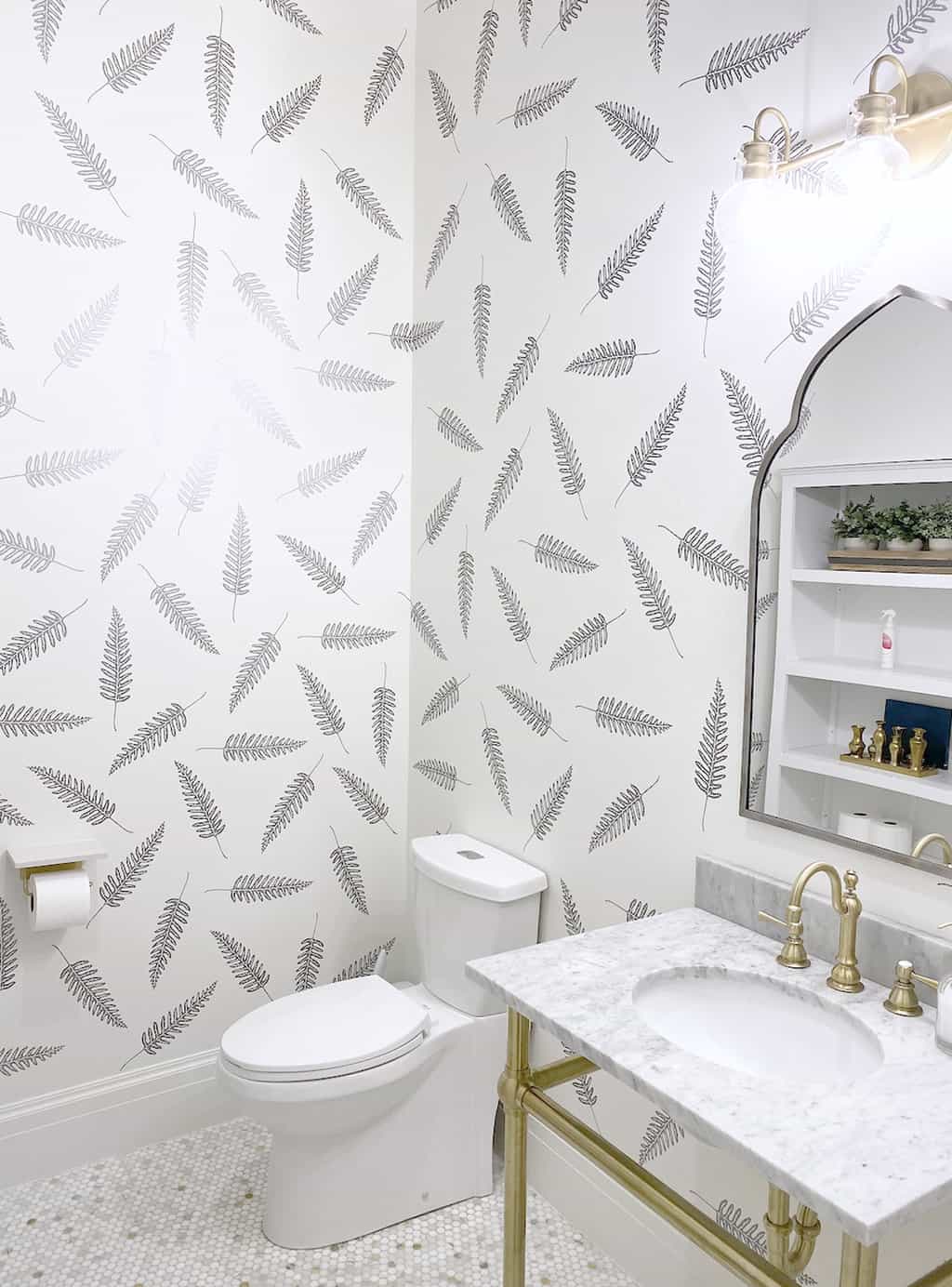 an image of diy fern cricut decals turned into wallpaper in a powder bathroom