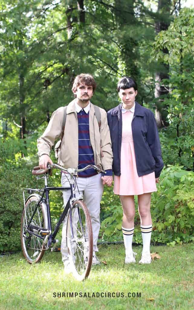 Stranger Things Halloween coupes costumes Mike and Eleven with a bicycle.