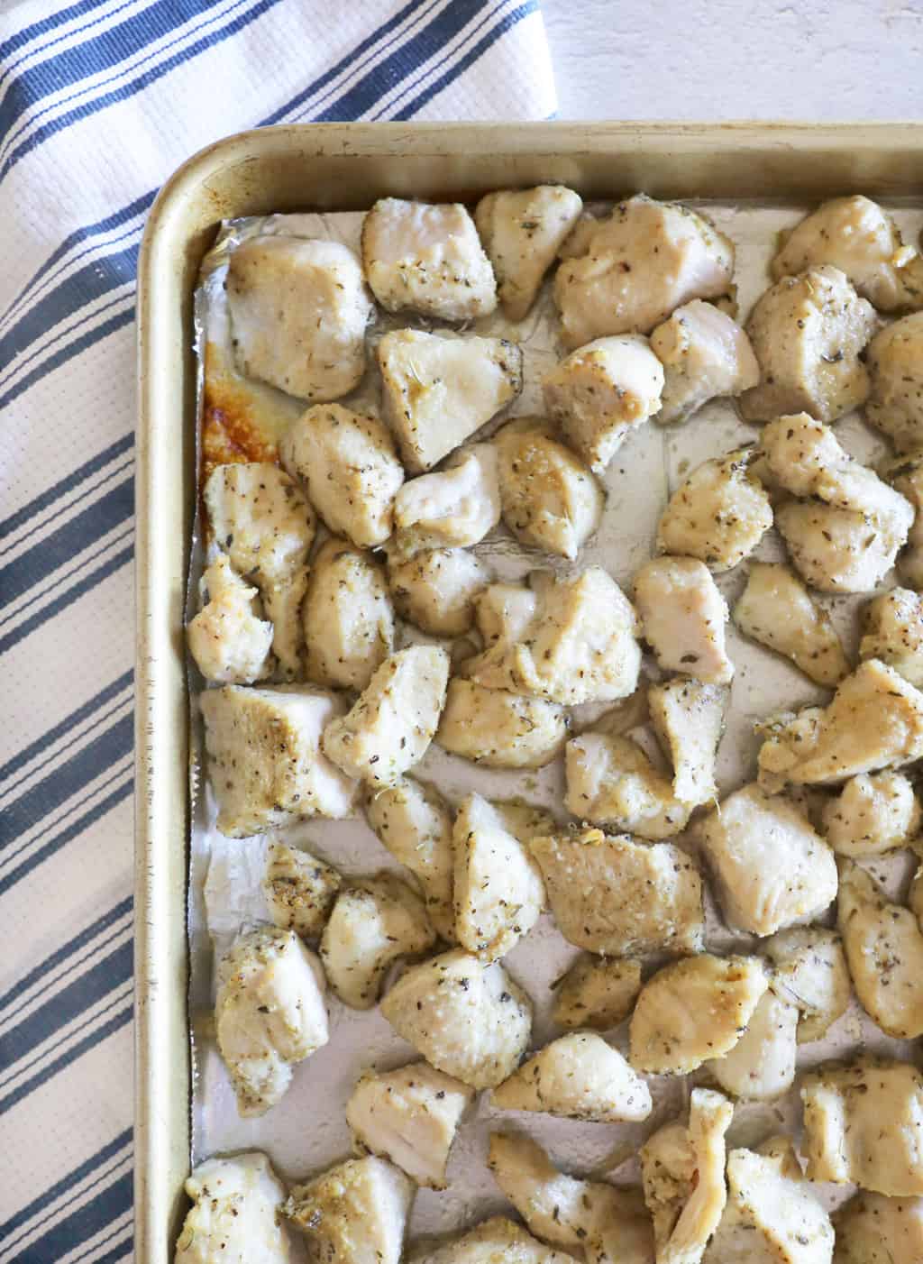 baked chicken bites just out of the oven on a sheet pan