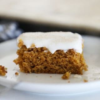 a square of pumpkin sheet cake in front of the pan