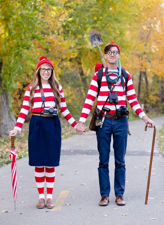 A woman and a man dressed as Where's Waldo for a couples costume on Halloween.