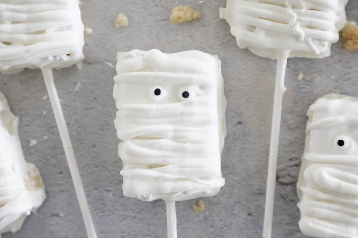 Zoomed in shot of Rice Krispie treat mummy with candy eyes.