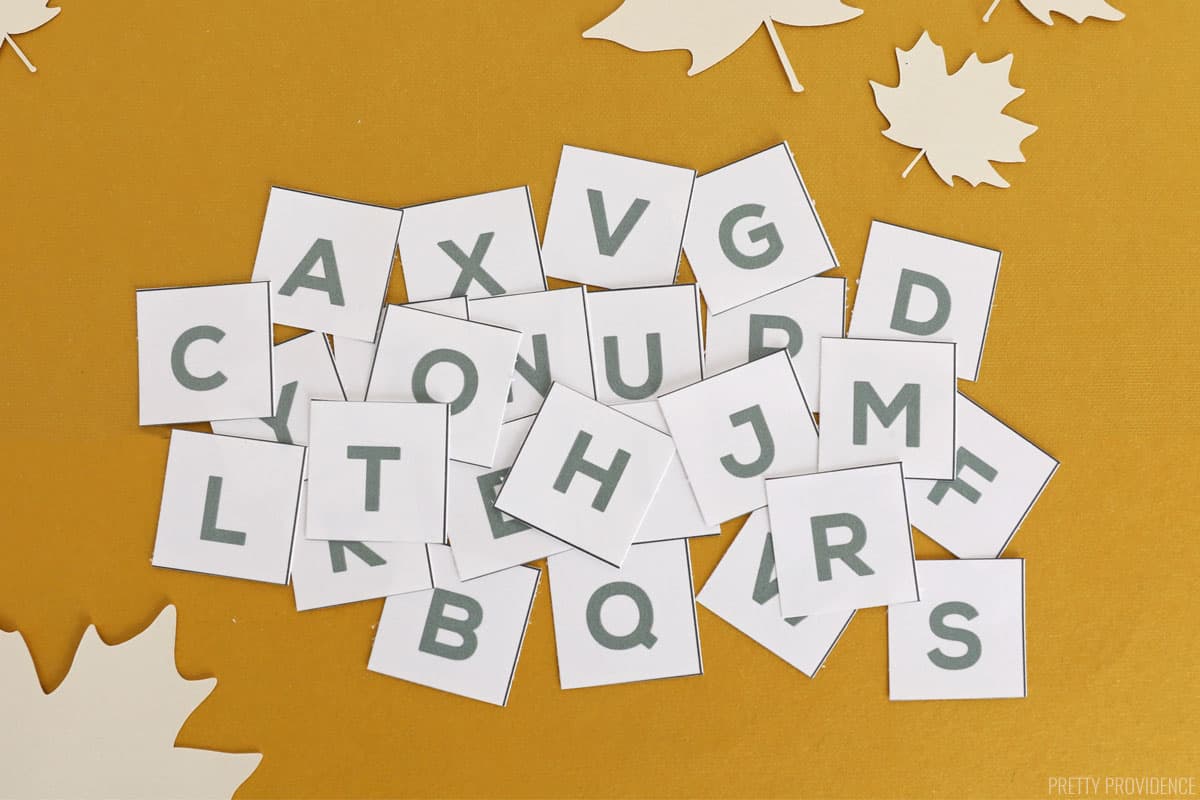 printable scattergories alphabet letters cut out on a yellow surface.