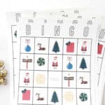 Christmas bingo cards with hershey kisses next to them