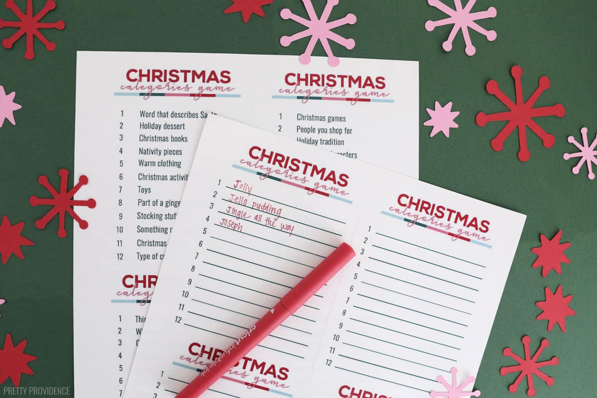 Christmas Scattergories game card with answers written on it, red pen resting on top.