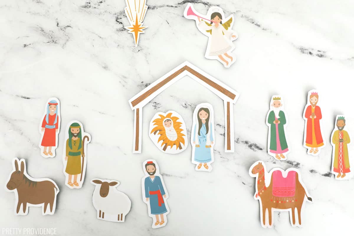 magnetic nativity set printed on magnetic sheets lying on a marble surface