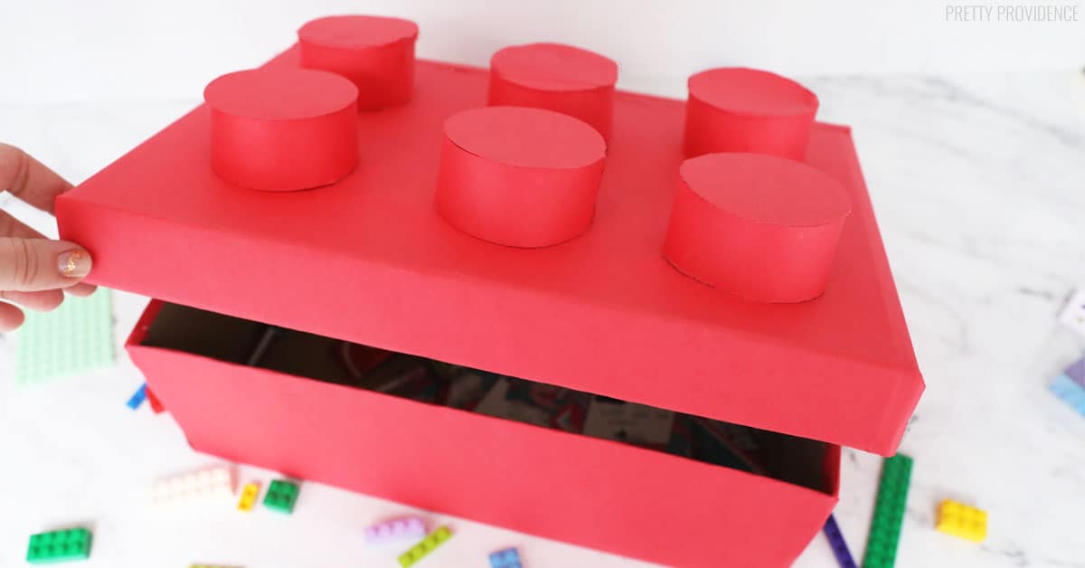 Red Lego shaped Valentines Box being opene.