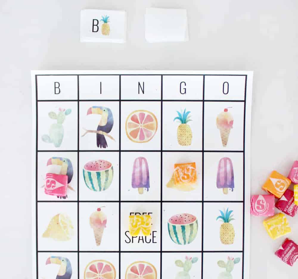 Top half of a summer bingo board with starbursts for markers. 