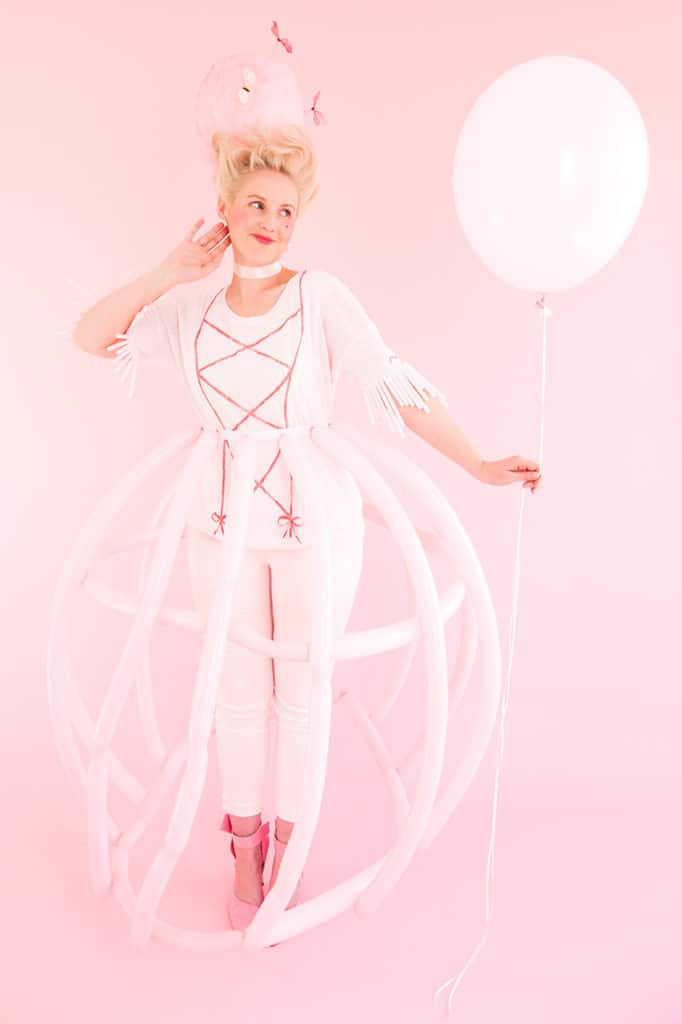 Woman in a DIY Marie Antoinette costume made from balloons, batting, elastic and hot glue.