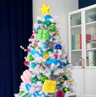 Lego Christmas tree, a white tree with large colorful lego ornaments and small ornaments made from lego bricks.