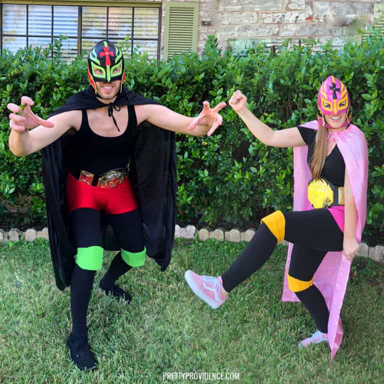 Man and woman in Lucha Libre Mexican Wrestling Luchador Costumes.