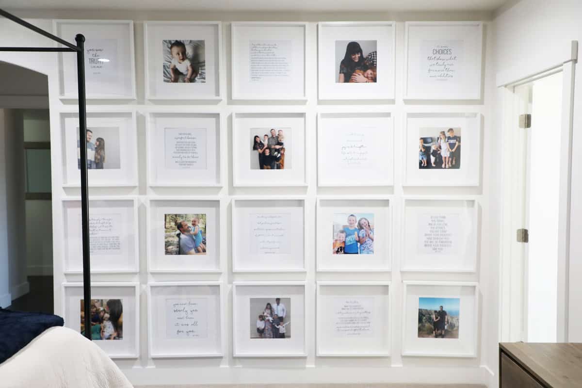 A gallery wall with a mix of photos and quotes on a wall in a master bedroom.