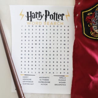An image of a Harry Potter word search next to a wand and a griffindor cloak.