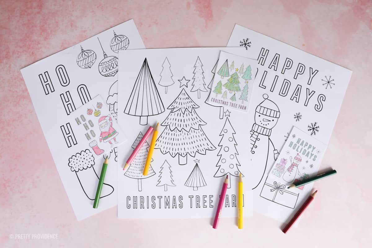 Christmas coloring sheets printed on white paper with miniature versions of the same coloring sheets for elf on the shelf and mini coloring pencils. 