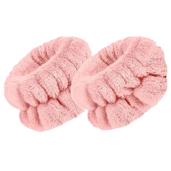 Pink microfleece face washing wrist bands on a white background.