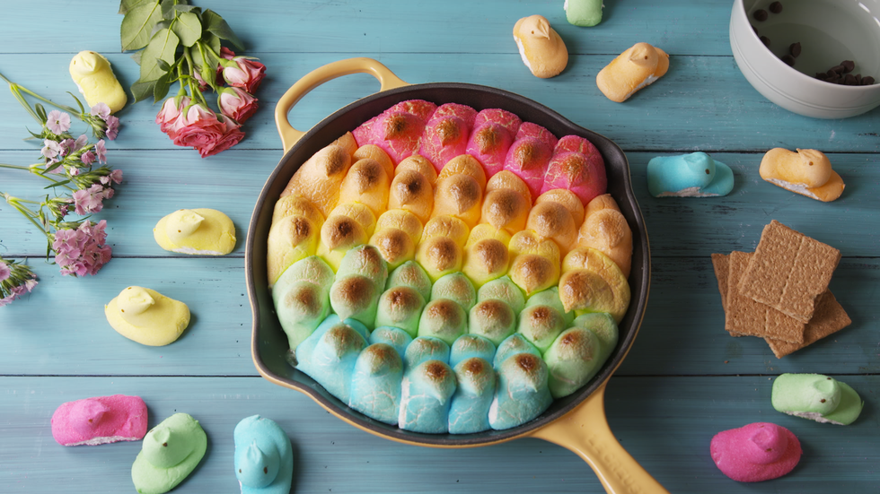 A skillet filled with rainbow colored peeps.