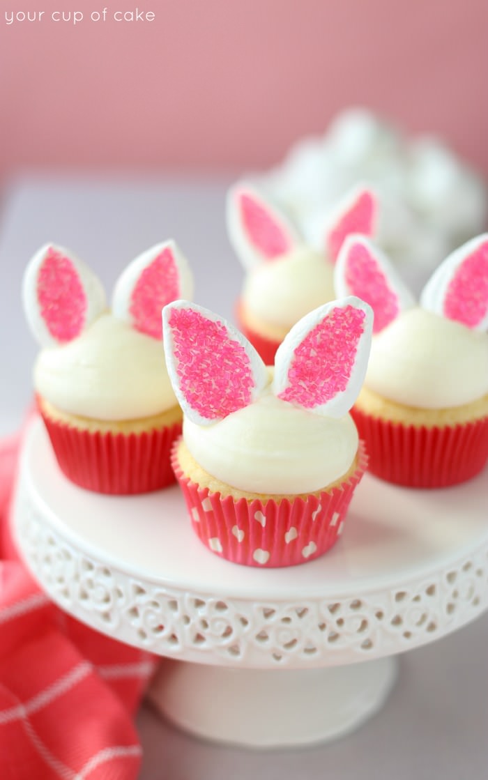 Bunny ear cupcakes on a white cakestand.