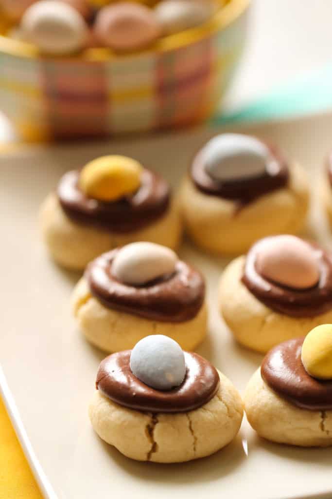 Chocolate thumbprint cookies with a chocolate Cadbury egg on top.