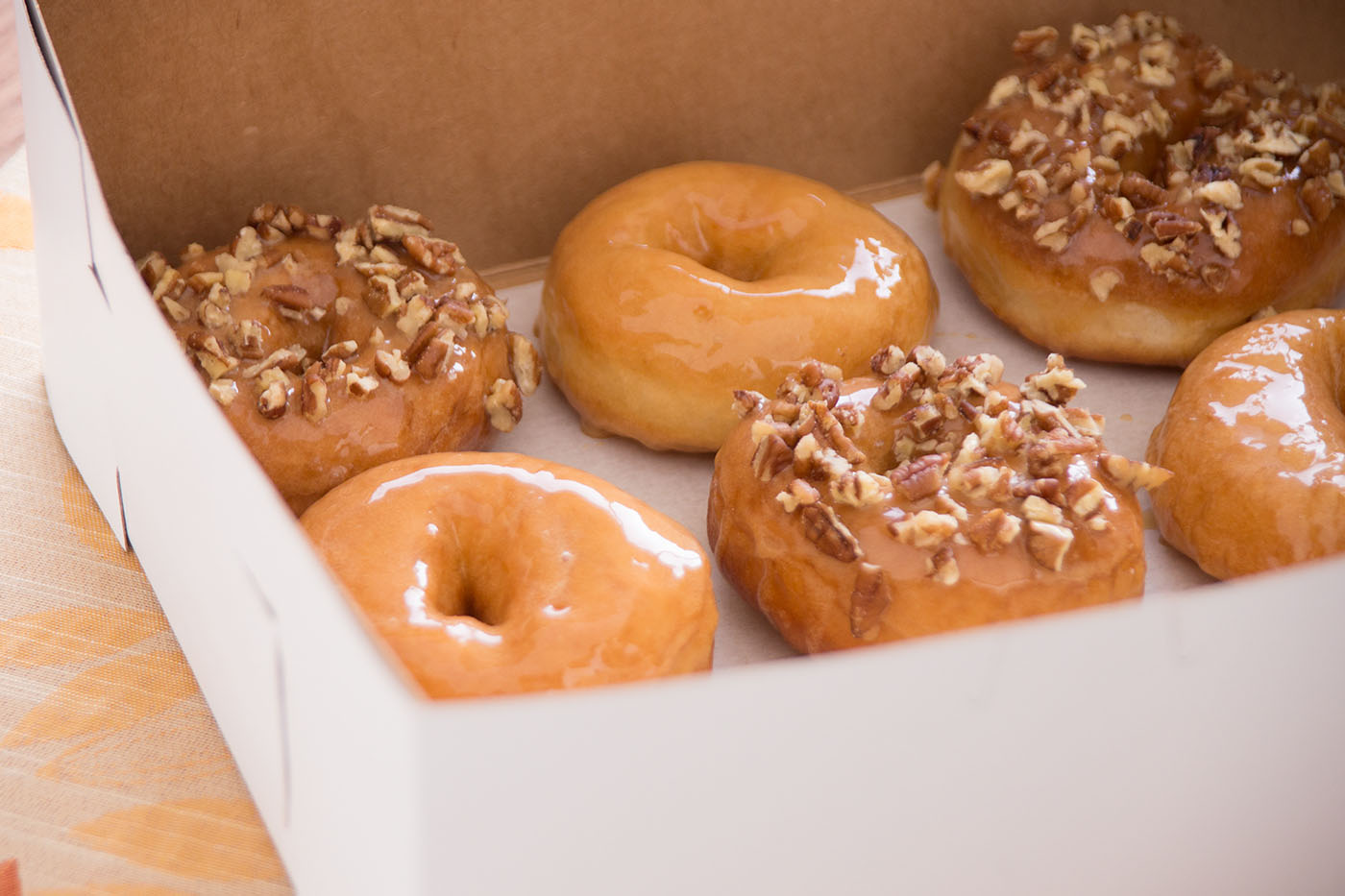A box of open doughnuts.