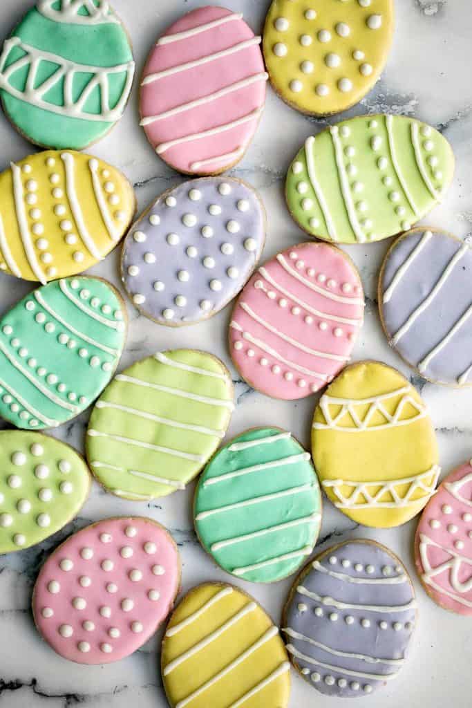Bird's eye view of sugar cookies decorated like Easter eggs.
