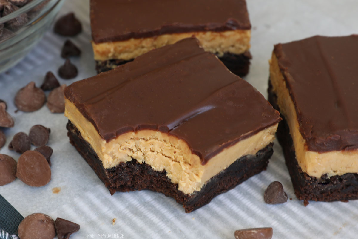 Peanut butter brownies, one with a bite taken out of it. 