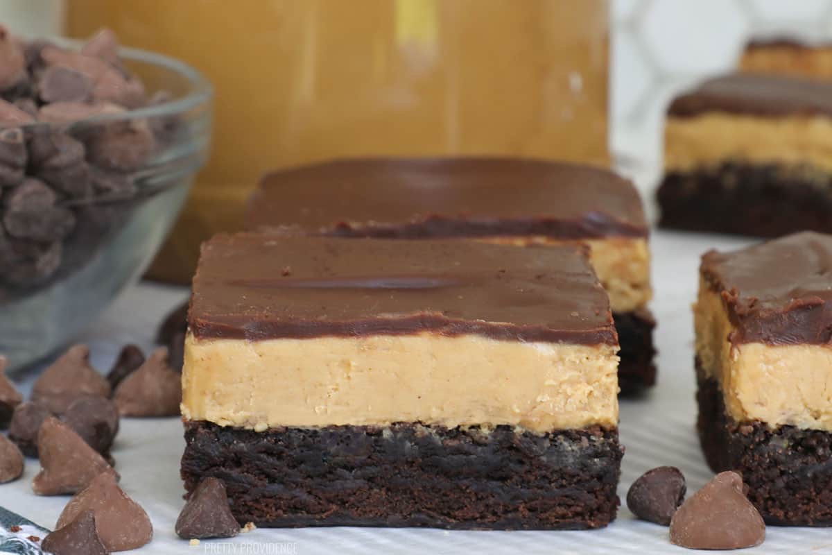 Peanut butter brownies with peanut butter layer and chocolate ganache on top.