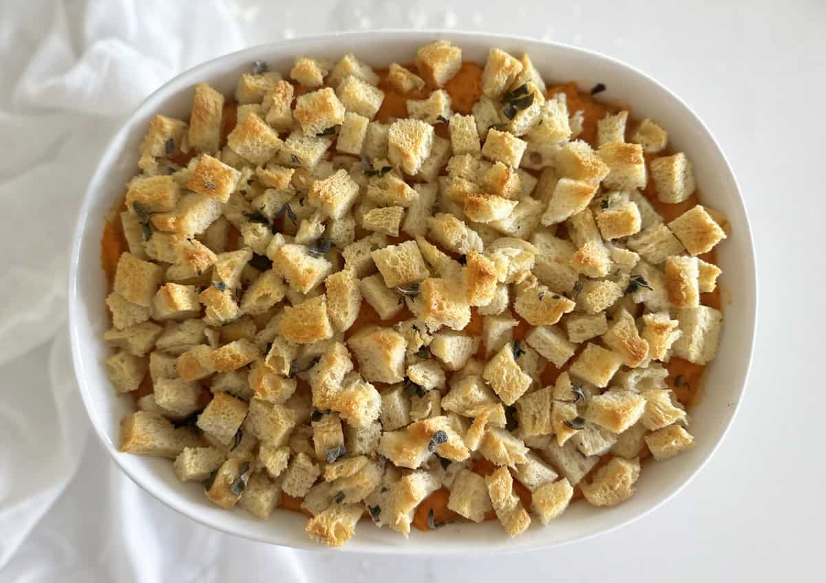 Bird's eye view of a sweet potato casserole with savory sage breadcrumbs. 