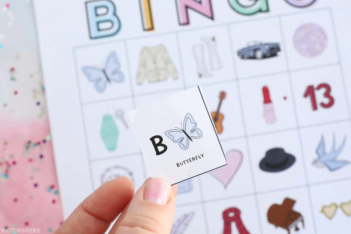 Printable Swiftie Themed Bingo calling card with the letter 'B' and a butterfly on it.