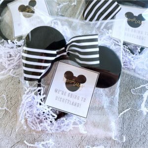 A cellophane bag with Disney Ears and a tag saying "we're going to Disneyland"
