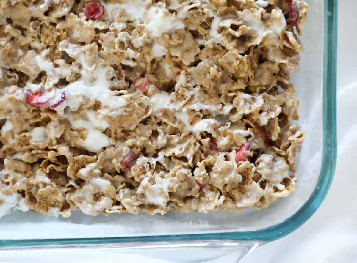 A Birds Eye view of a glass 9x13 pan with strawberry cereal bars in it.