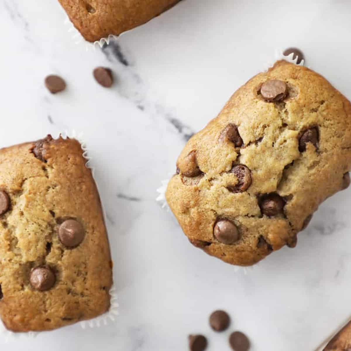 An image showing two mini loaves of banana bread with chocolate chips.